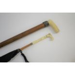 IVORY HANDLED PARASOL - BRIGG the ivory handle carved with flowers and leaves and with a black