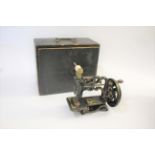 BOXED JAMES WEIR SEWING MACHINE a small cast iron based sewing machine, with it's original wooden