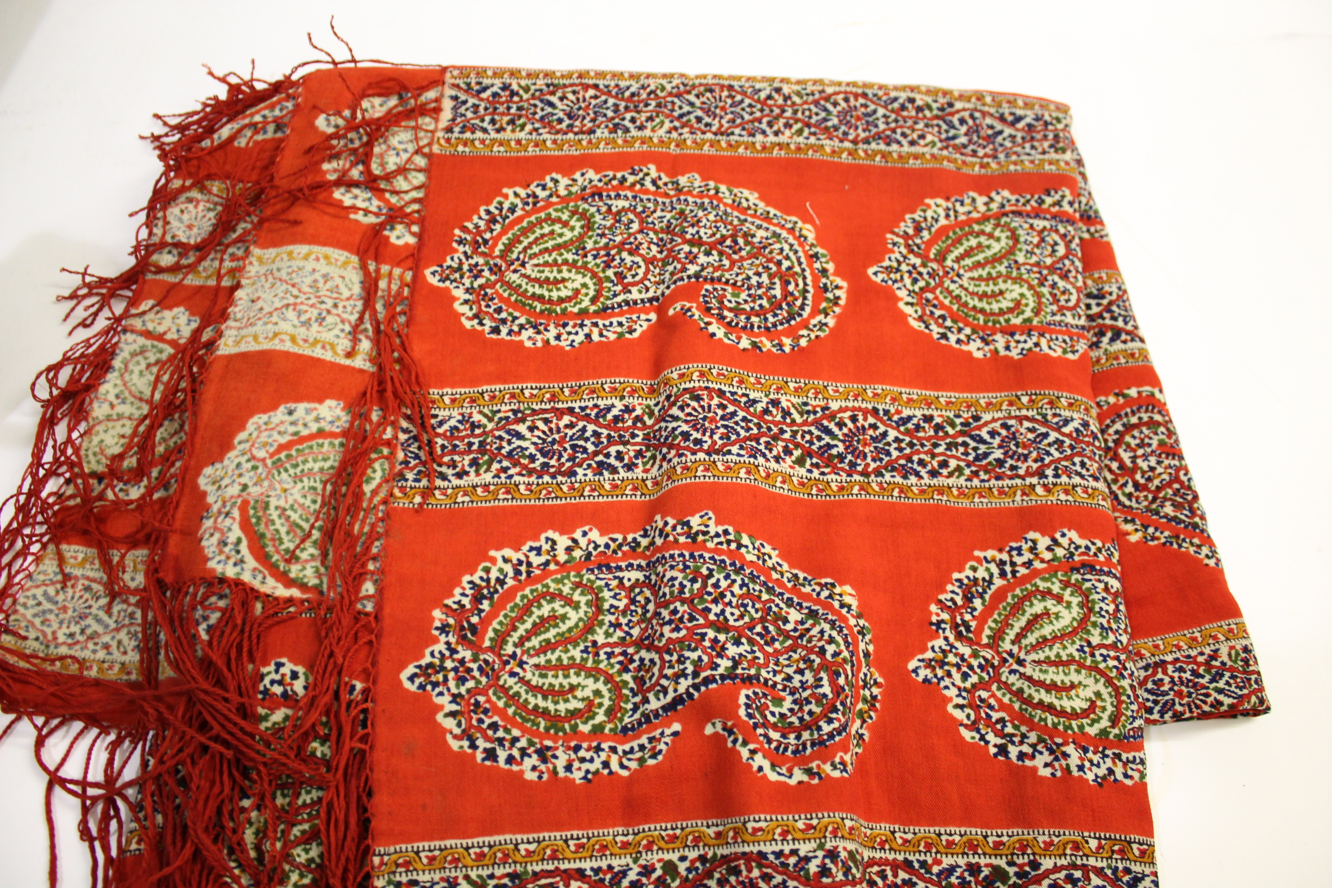 19THC PAISLEY SHAWL a fringed wool shawl, also with an Eastern European embroidered apron, an Indian