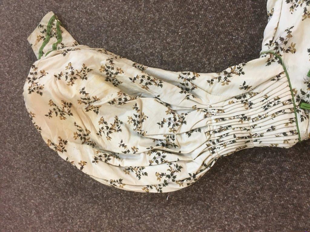 19THC CREAM SILK PATTERNED DAY DRESS with green silk ribbon detail, 123cms long. Also with a Paisley - Image 9 of 21