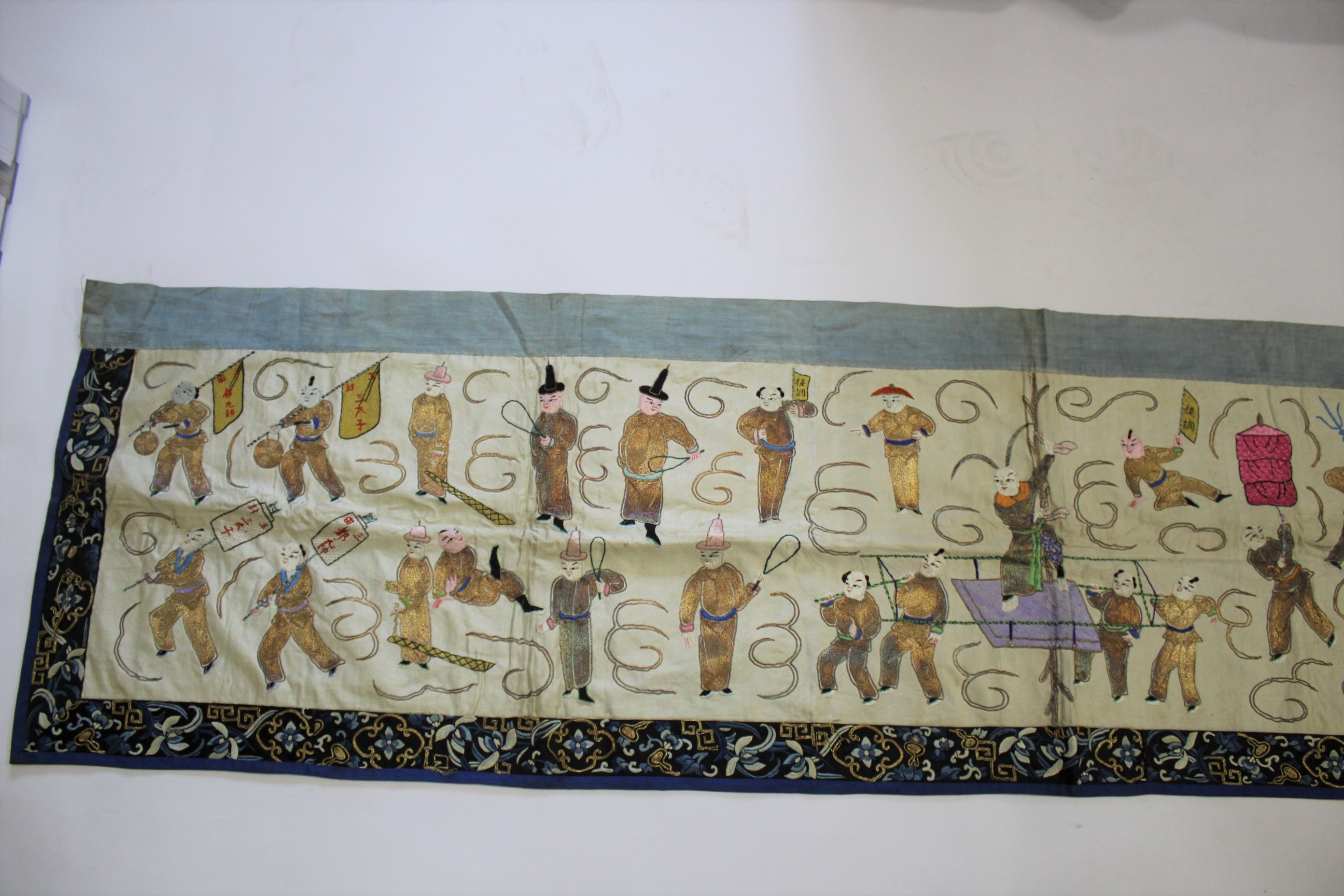 CHINESE SILK TABLE RUNNER early 20thc, the runner embroidered with various processional figures - Image 5 of 9