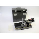 SINGER SEWING MACHINE - 221K a folding portable Singer 221K sewing machine, in it's case and with