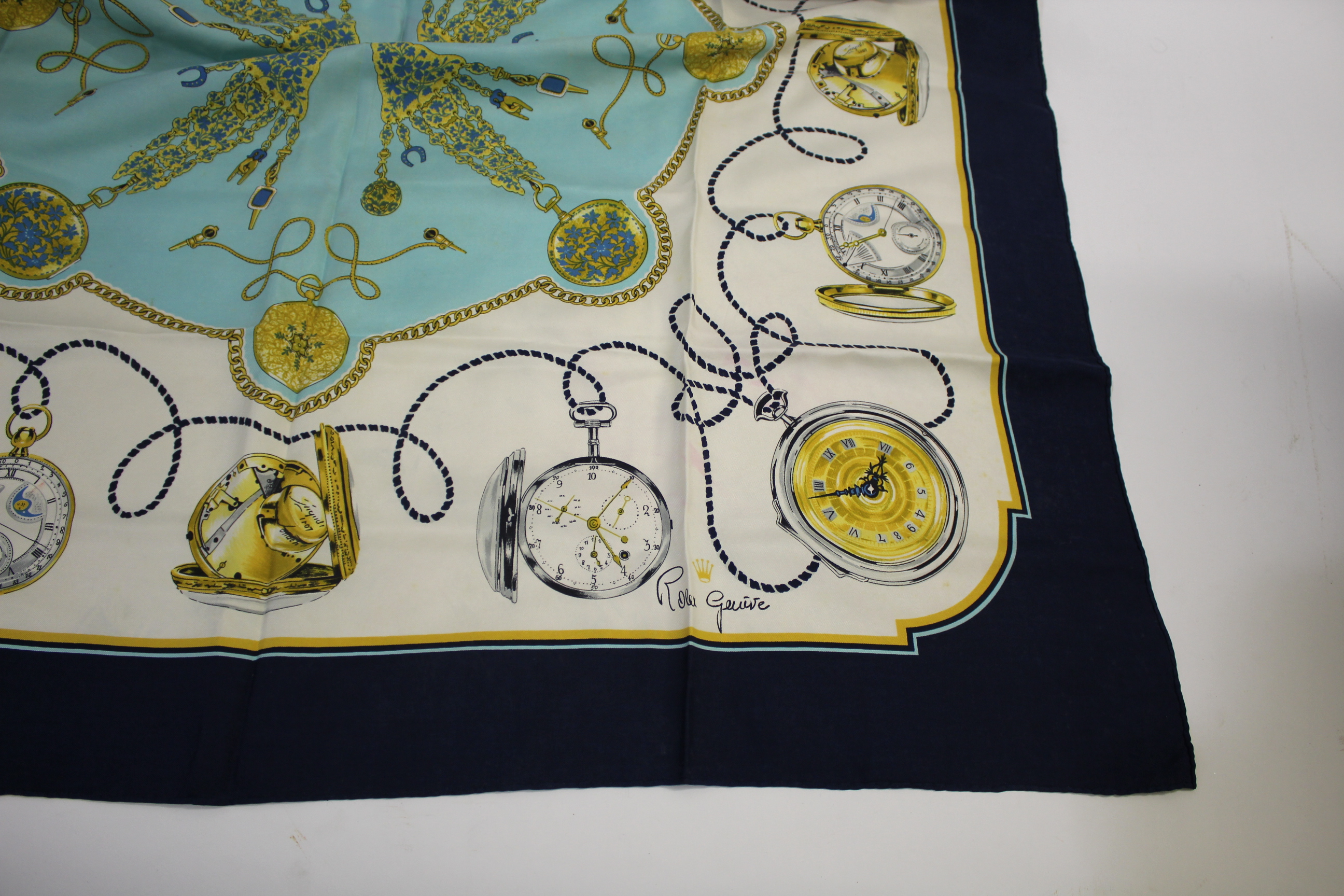 ROLEX SILK SCARVES 3 Rolex silk scarves including a pair, each signed Rolex, Geneve. Also with