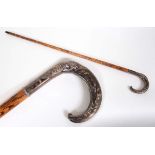 SILVER TOP WALKING STICK - FOX & PHEASANT a walking stick with a wooden shaft and curved silver top,