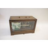 CASED BAROGRAPH by Wilson, Warden & Co Ltd, London, in a mahogany case. Case 31cms across