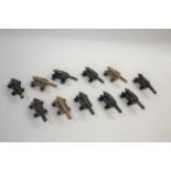 BRITAINS MODEL CANNONS a collection of 11 model naval cannons, the metal cannons mounted on wooden
