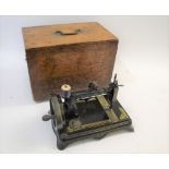 CASED SEWING MACHINE - ELIAS HOWE a Victorian cast iron based sewing machine by Elias Howe Jn, New
