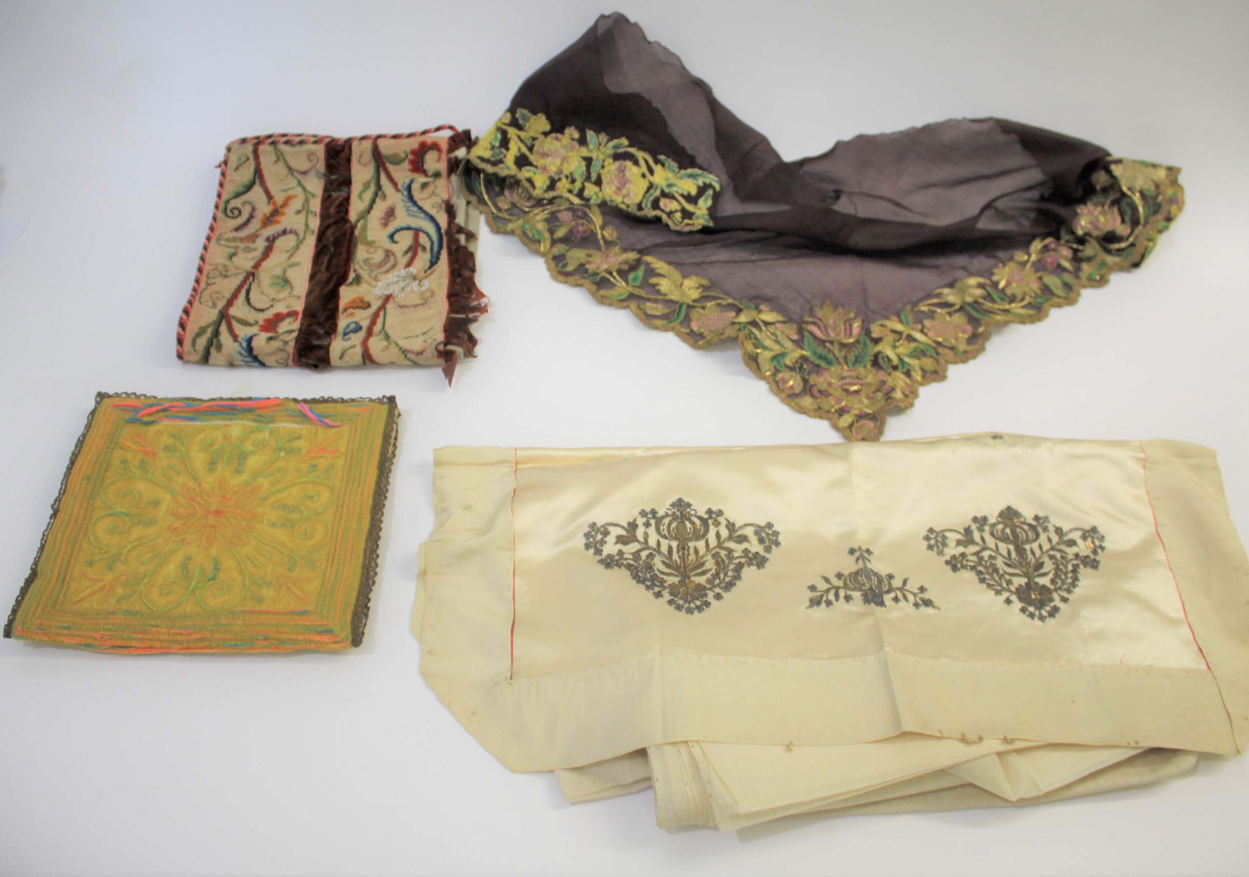 EARLY TEXTILES including a 19thc wool and bead cross stitch cushion cover, a fine brown silk