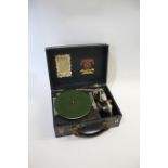 'THE GRIPPA' PORTABLE GRAMOPHONE a Pixie Perophone The Grippa portable gramophone, with a stylus and