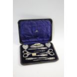 CASED SILVER MANICURE SET - MAPPIN & WEBB a leather fitted case, with a variety of silver manicure