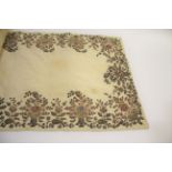 ANTIQUE EMBROIDERED SILK PANEL possibly Indian, a cream silk panel with jewel coloured silks and