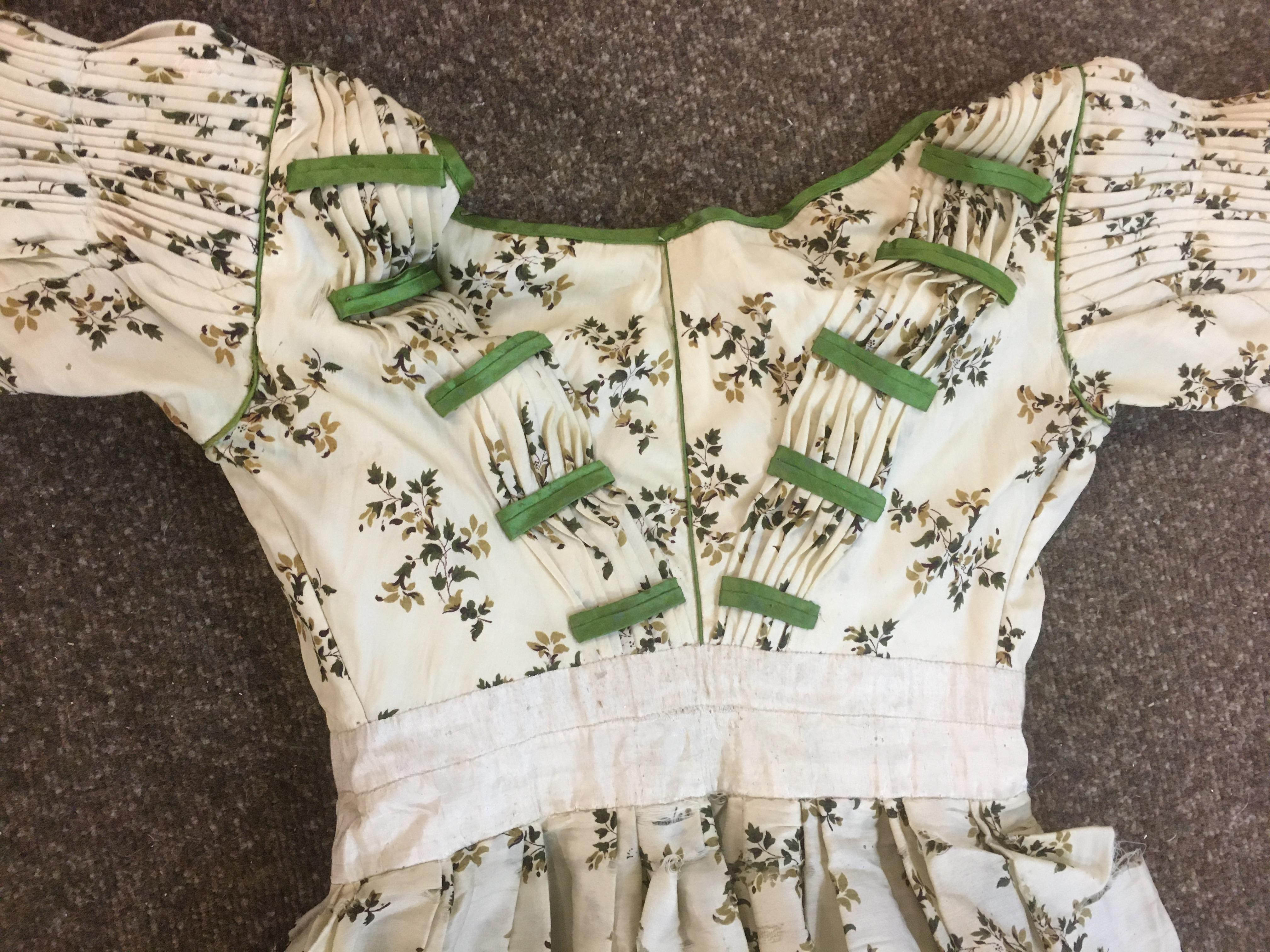 19THC CREAM SILK PATTERNED DAY DRESS with green silk ribbon detail, 123cms long. Also with a Paisley - Image 8 of 21