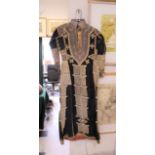 YEMEN WEDDING DRESS a late 19th/early 20thc black cotton wedding robe or dress, embroidered with