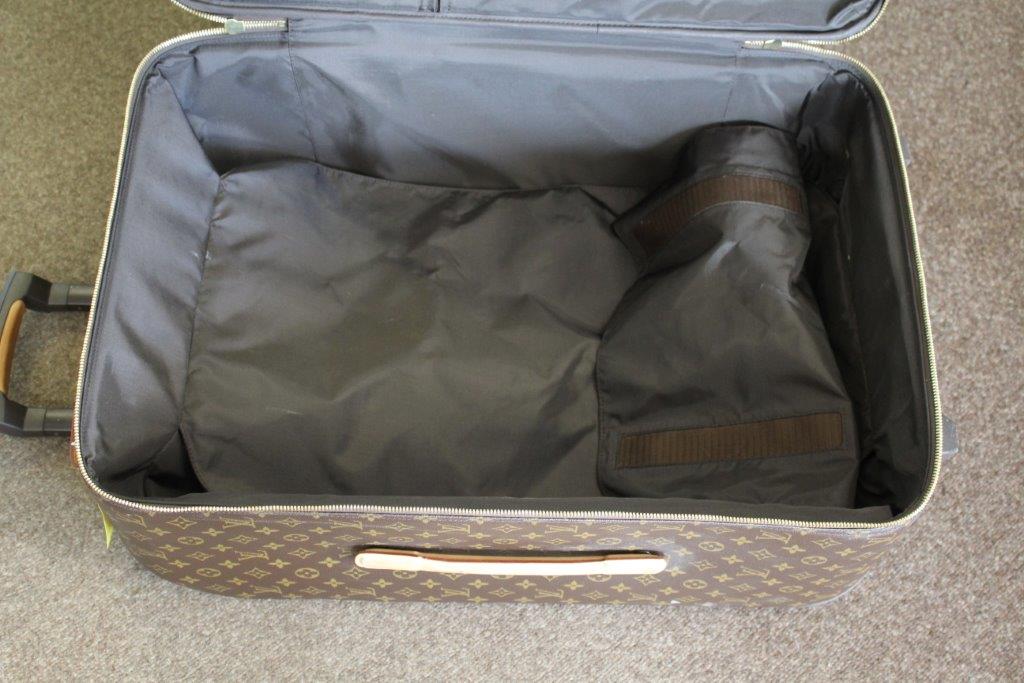 LOUIS VUITTON SUITCASE a large suitcase with monogrammed exterior and leather handles and strap, - Image 11 of 15