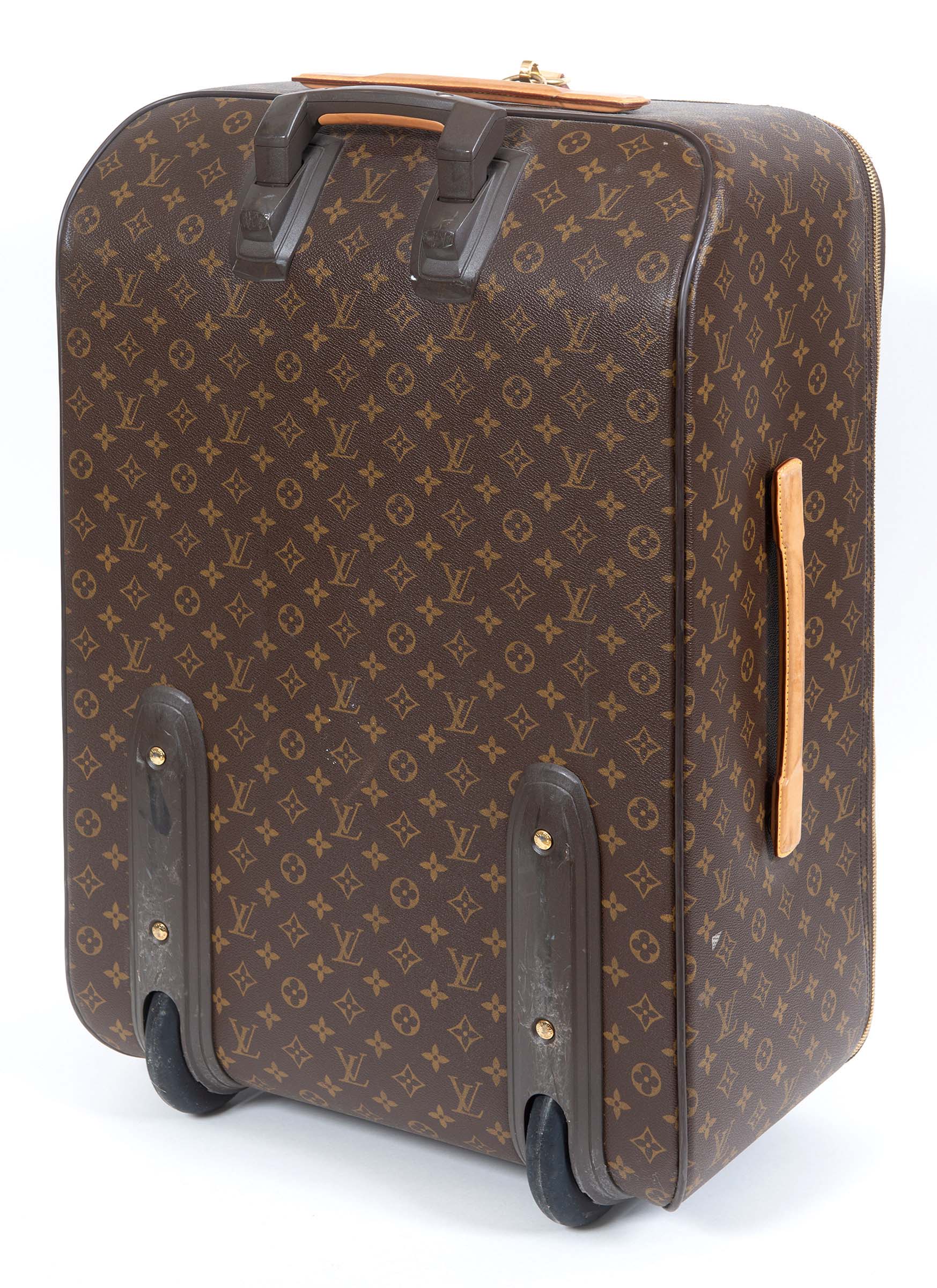 LOUIS VUITTON SUITCASE a large suitcase with monogrammed exterior and leather handles and strap,