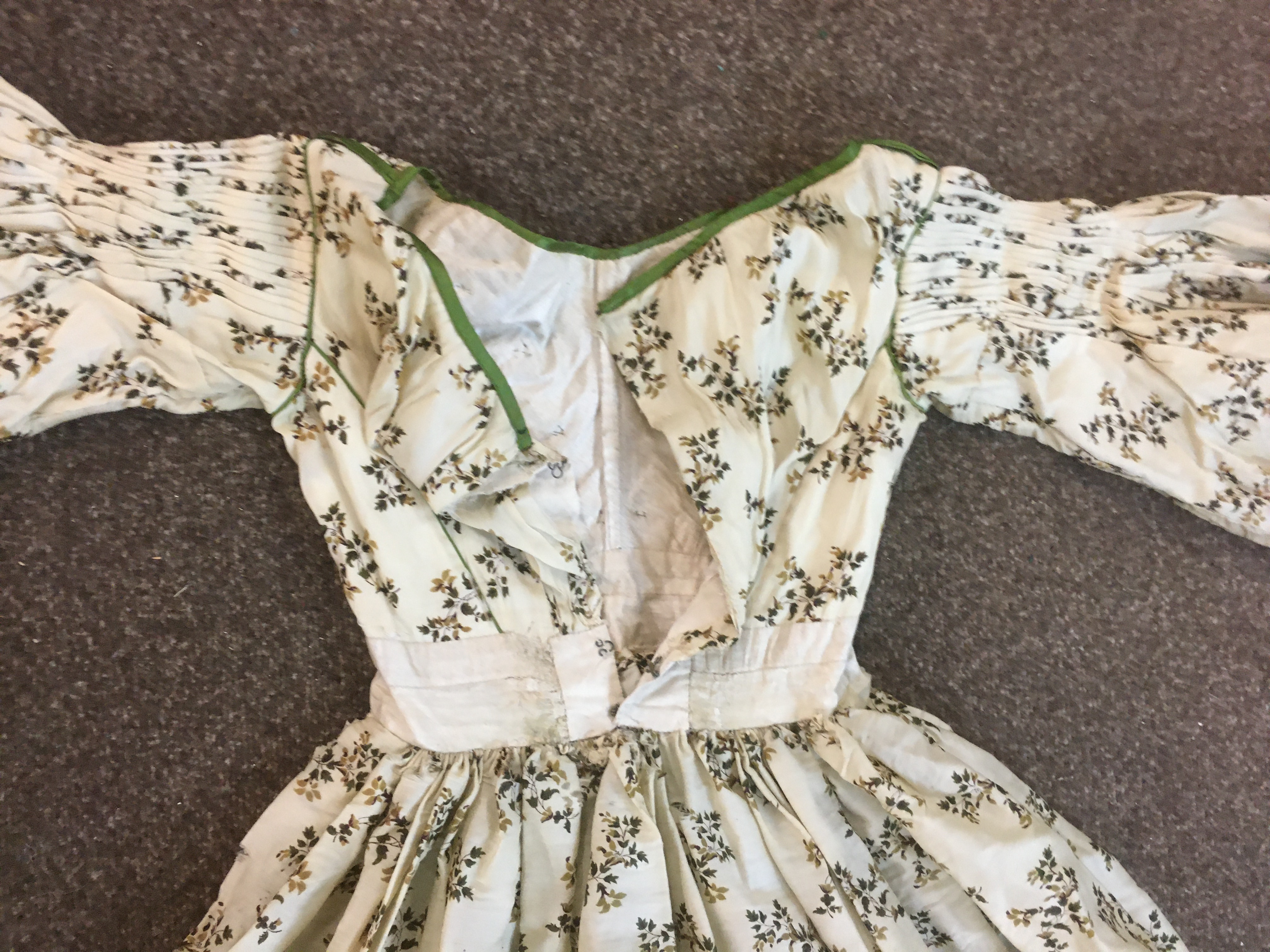 19THC CREAM SILK PATTERNED DAY DRESS with green silk ribbon detail, 123cms long. Also with a Paisley - Image 16 of 21