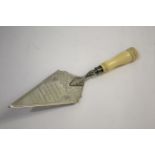 SRI LANKA INTEREST - 1911 PRESENTATION TROWEL a silver plated trowel with carved ivory handle,