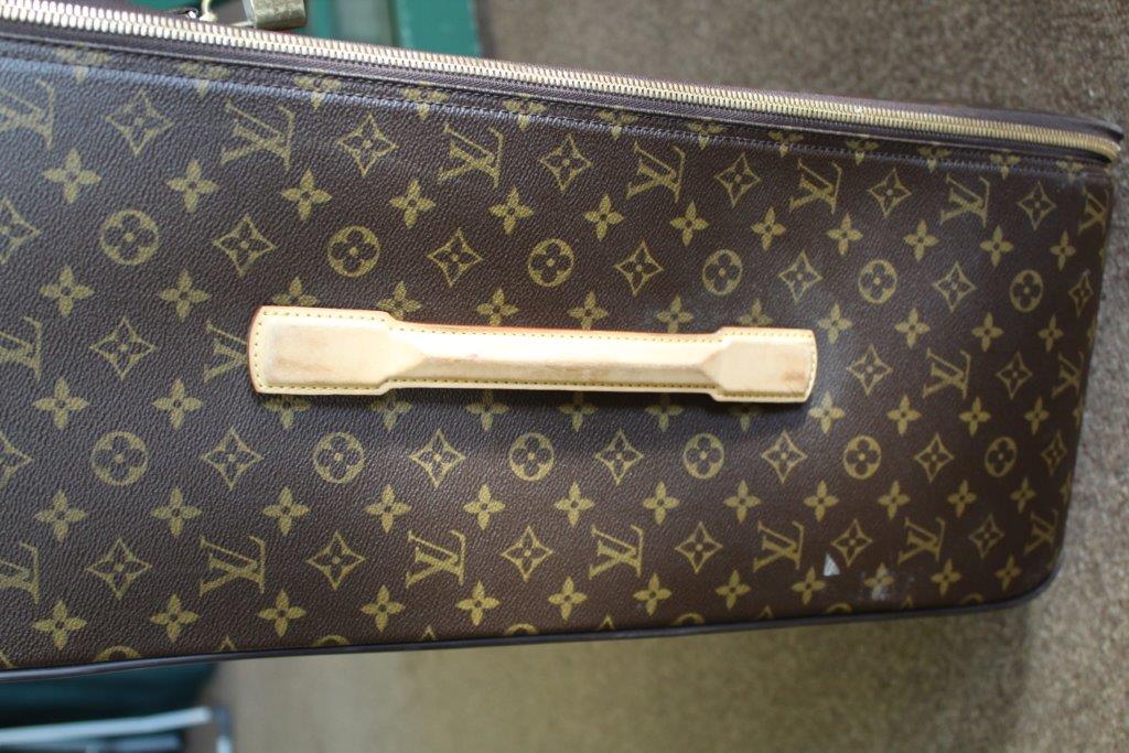 LOUIS VUITTON SUITCASE a large suitcase with monogrammed exterior and leather handles and strap, - Image 8 of 15