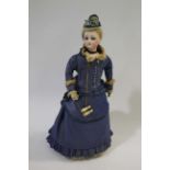 19THC FRENCH FASHION DOLL a long faced French bisque head doll with swivel neck, with pale blue