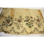 18THC CREAM SILK PANEL decorated with an embroidered flowing design of flowers and leaves, worked in