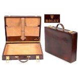 ROLEX LEATHER BRIEFCASE a directors leather briefcase with brass catches, the interior with