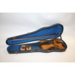 ANTIQUE VIOLIN with a 2 piece back and rosewood tuning pegs, with a spurious label inside Joseph