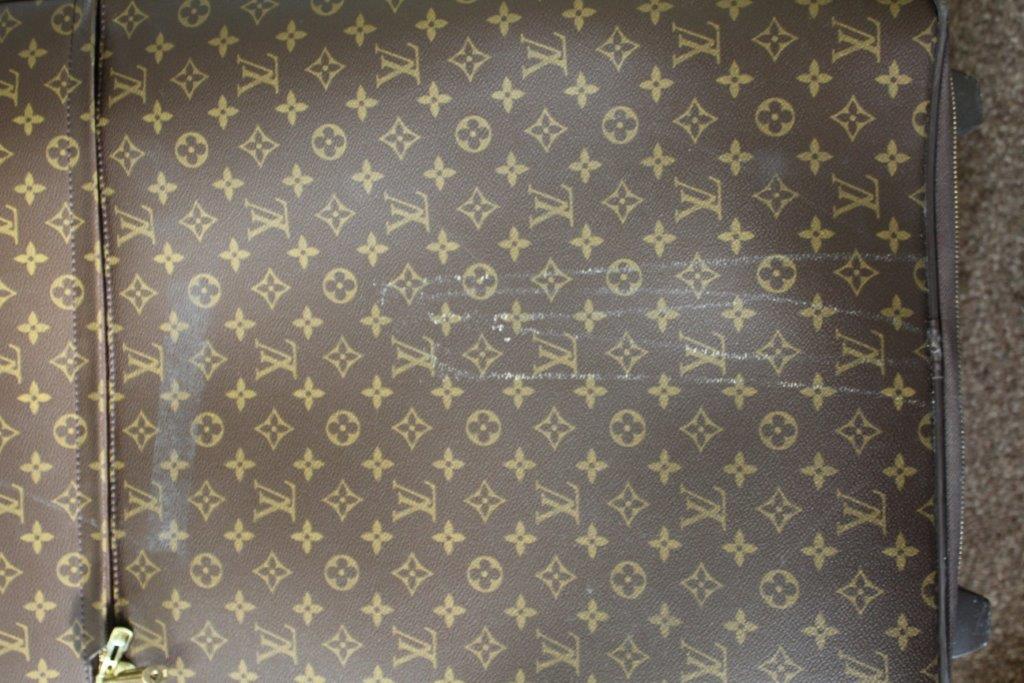 LOUIS VUITTON SUITCASE a large suitcase with monogrammed exterior and leather handles and strap, - Image 10 of 15