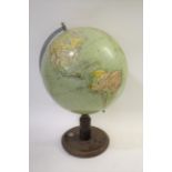 VINTAGE GLOBE a large globe mounted on a wooden stand, and with a compass set into the base. With