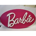 BARBIE SIGN a large oval cardboard sign, with white lettering on a pink background. Made in 2015,