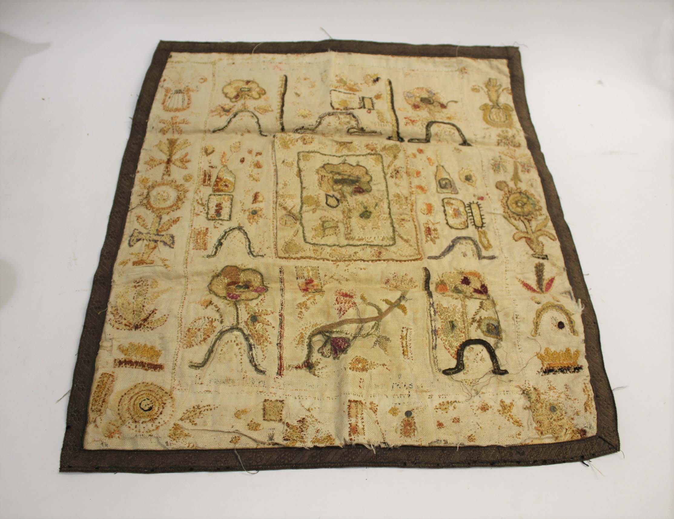 RARE 17THC SPOT SAMPLER a spot sampler onto linen with various flowers depicted, including a later