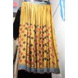 ANTIQUE INDIAN SKIRT a full length gathered skirt made from 19thc gold coloured silk, embroidered