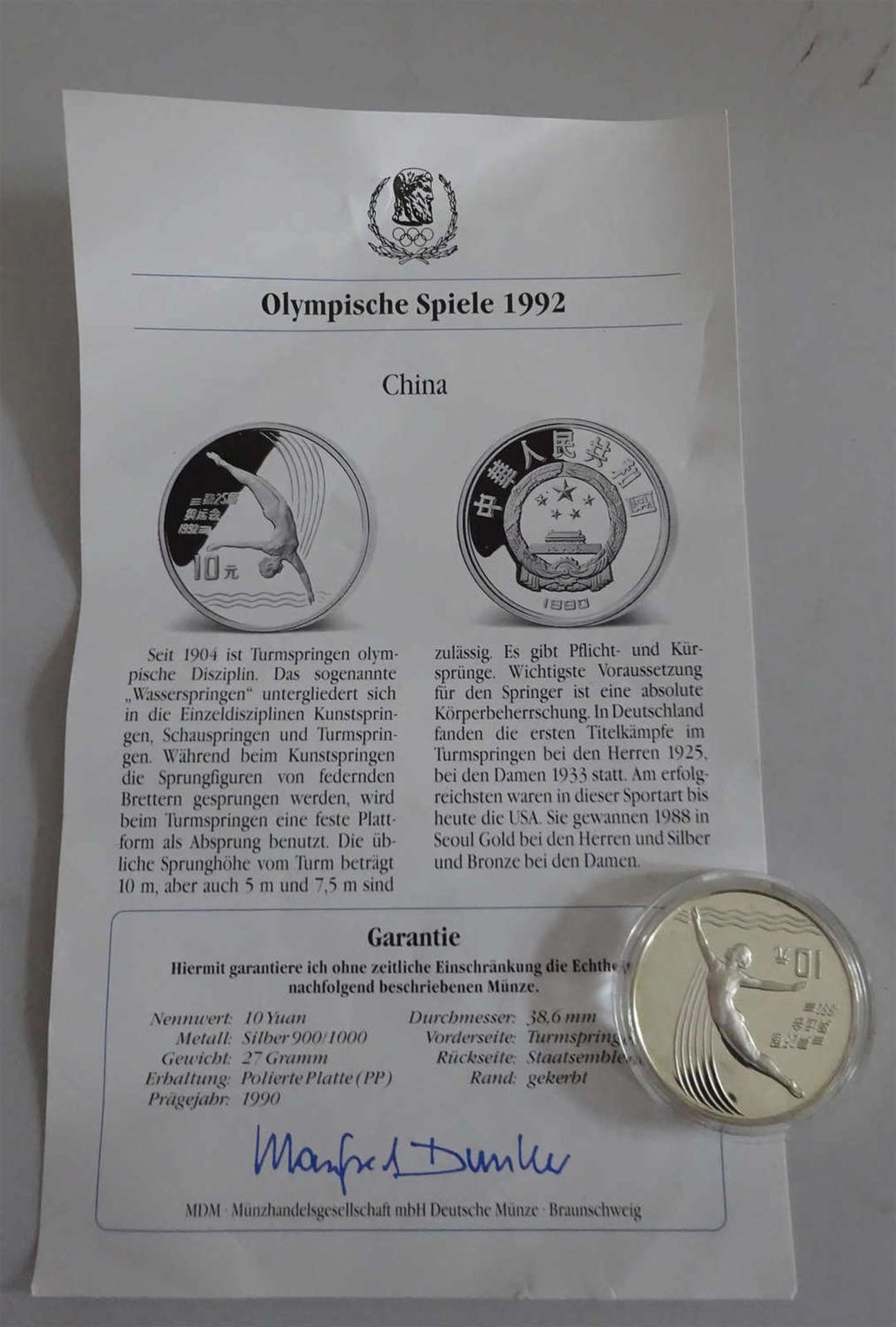 China 1990, 10 Yuan - Silbermünze "Olympische Spiele 1992 - Turmspringerin". In Kapsel. Erhaltung:
