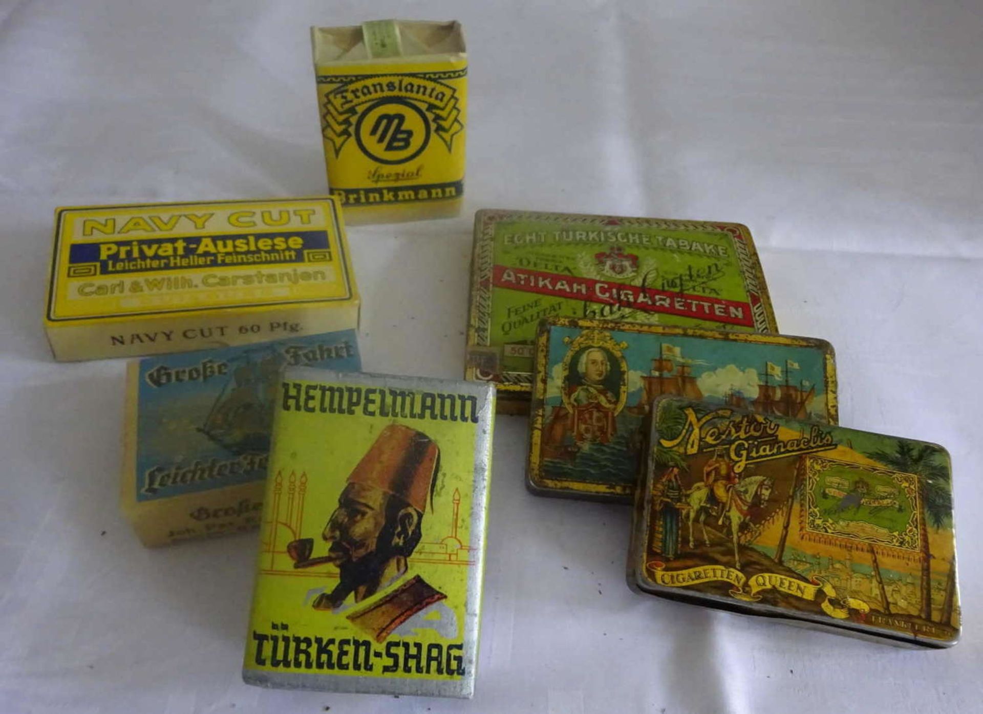 Lot Tabakwaren, bestehend aus 3 leeren Metall Zigarettenschachteln, sowie 4 alte Schachteln mit