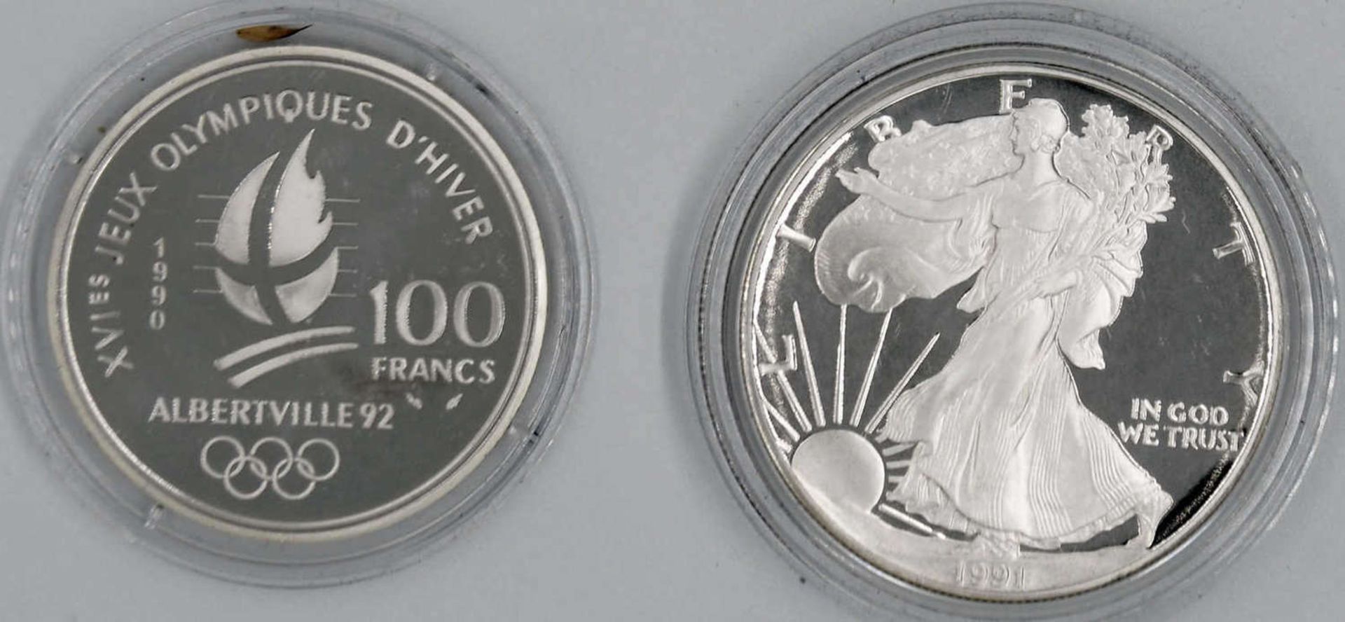 Zwei Silbermünzen: 1 x USA 1991 1 Dollar, 1 oz. Silber und 1 x Frankreich 1990 100 Francs "