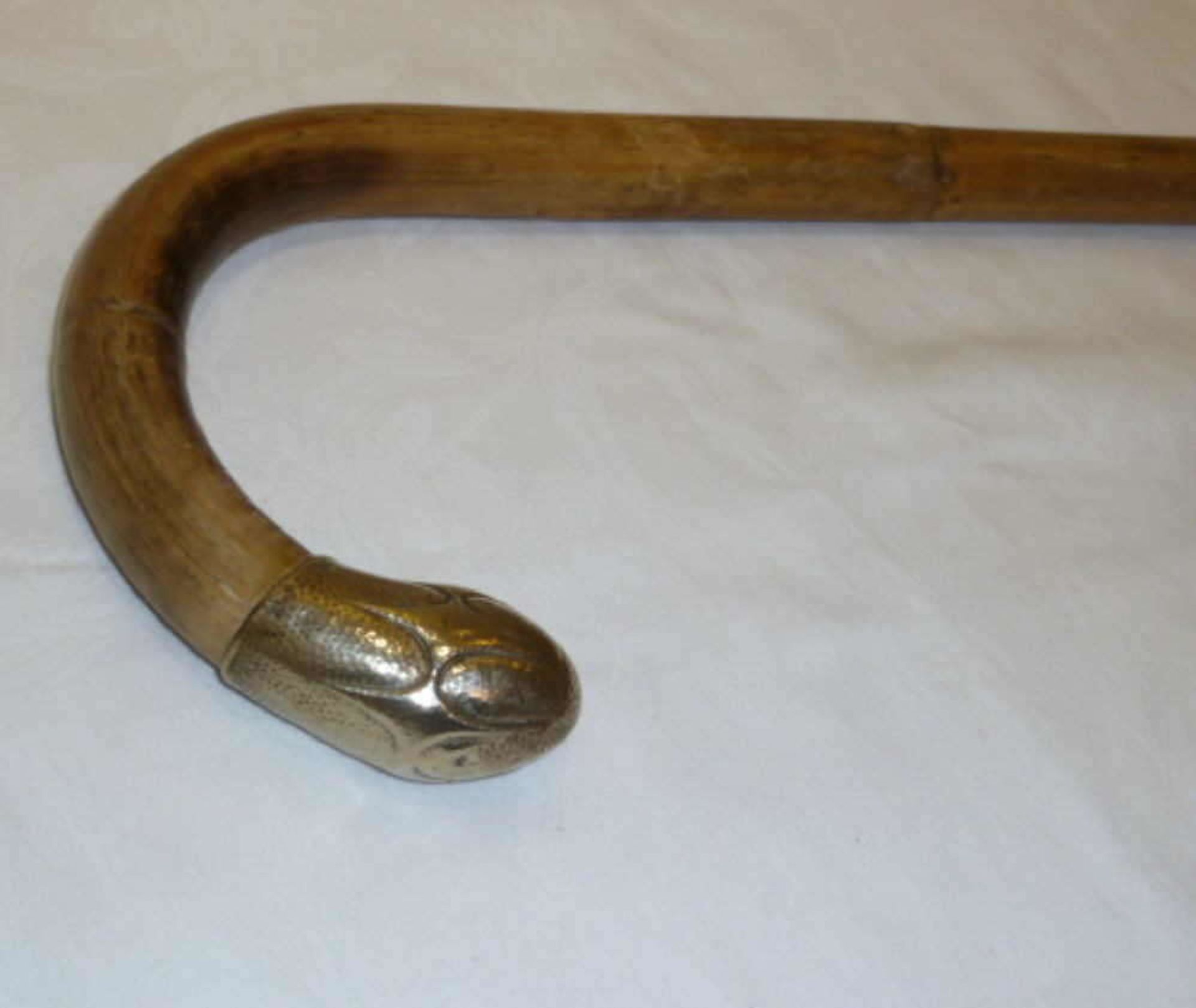 Antique walking stick with Alpacca silver handle around 1930. Height about 90 cm.