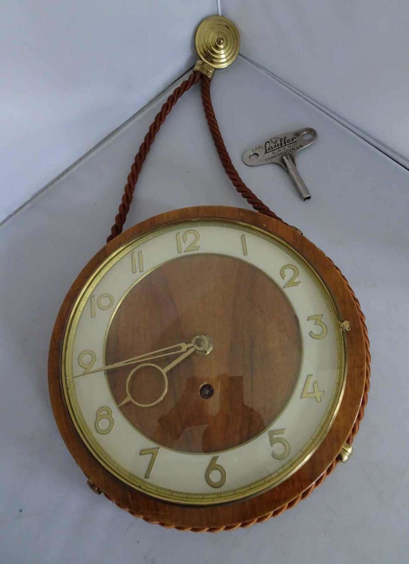 1 wall clock Lauffer, with key, about 24 cm in diameter