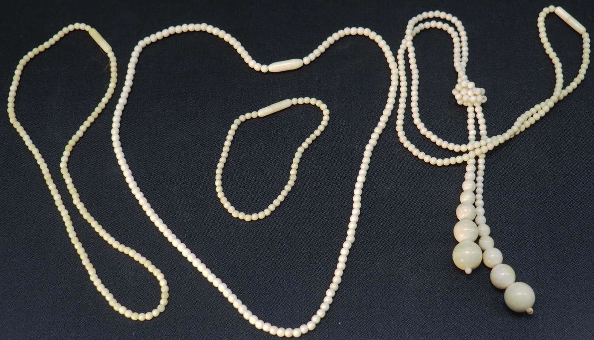 Lot ivory jewelry, consisting of three chains, and a bracelet. Different models.