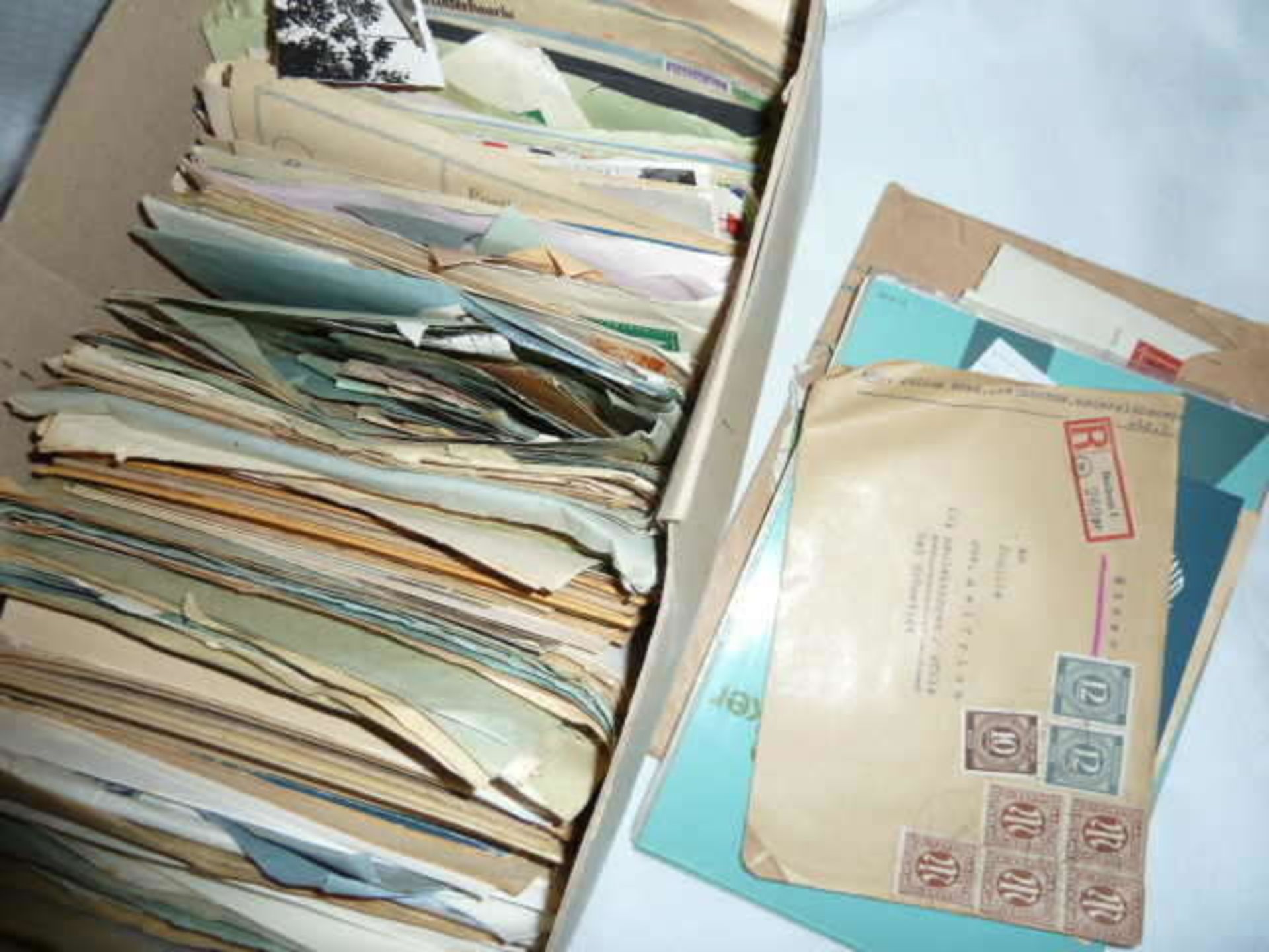 Original post stamps in a cardboard box, mostly German territories. Safe treasure trove!