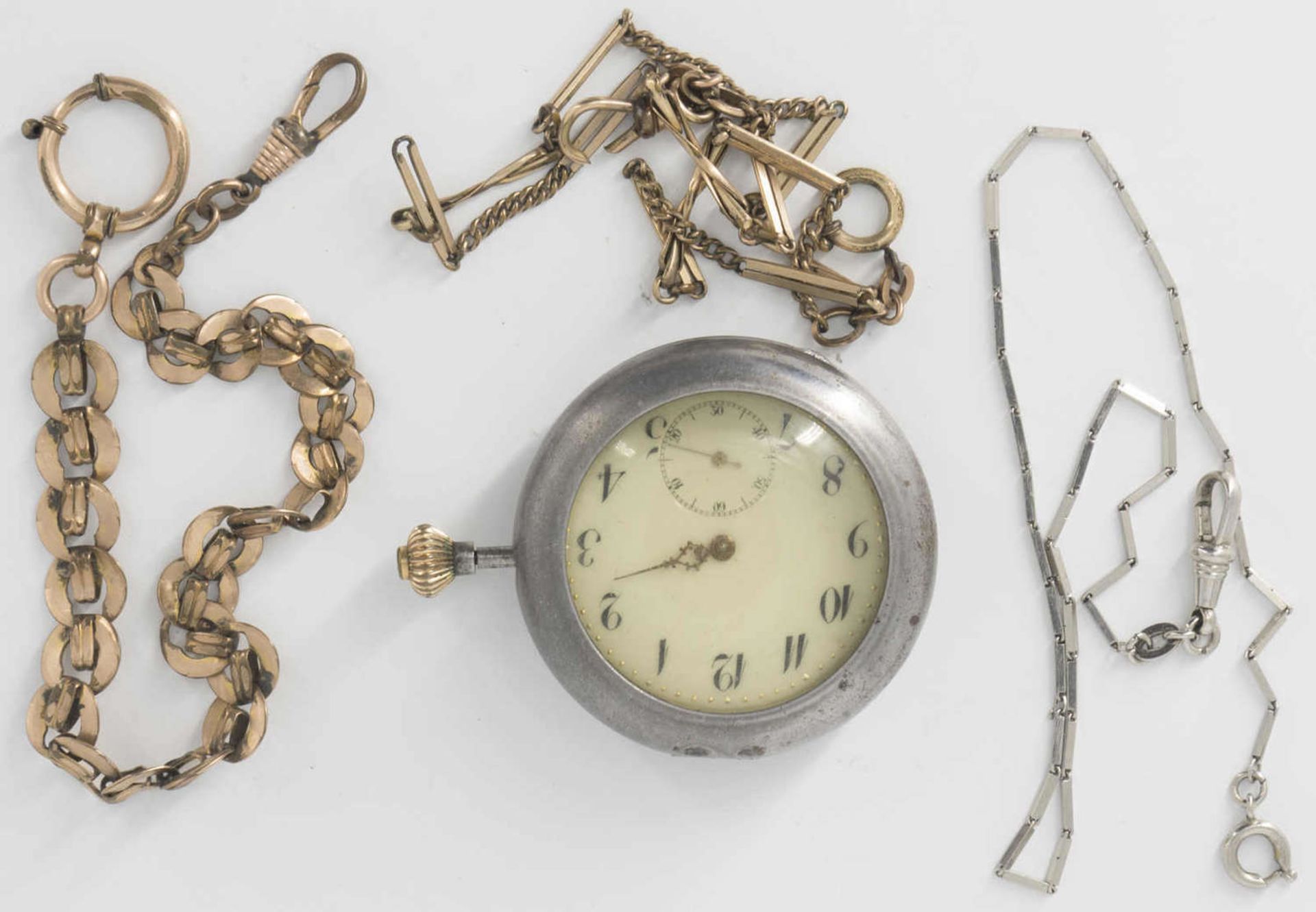 Pocket watch without cover in watch case. In addition three clock chains.