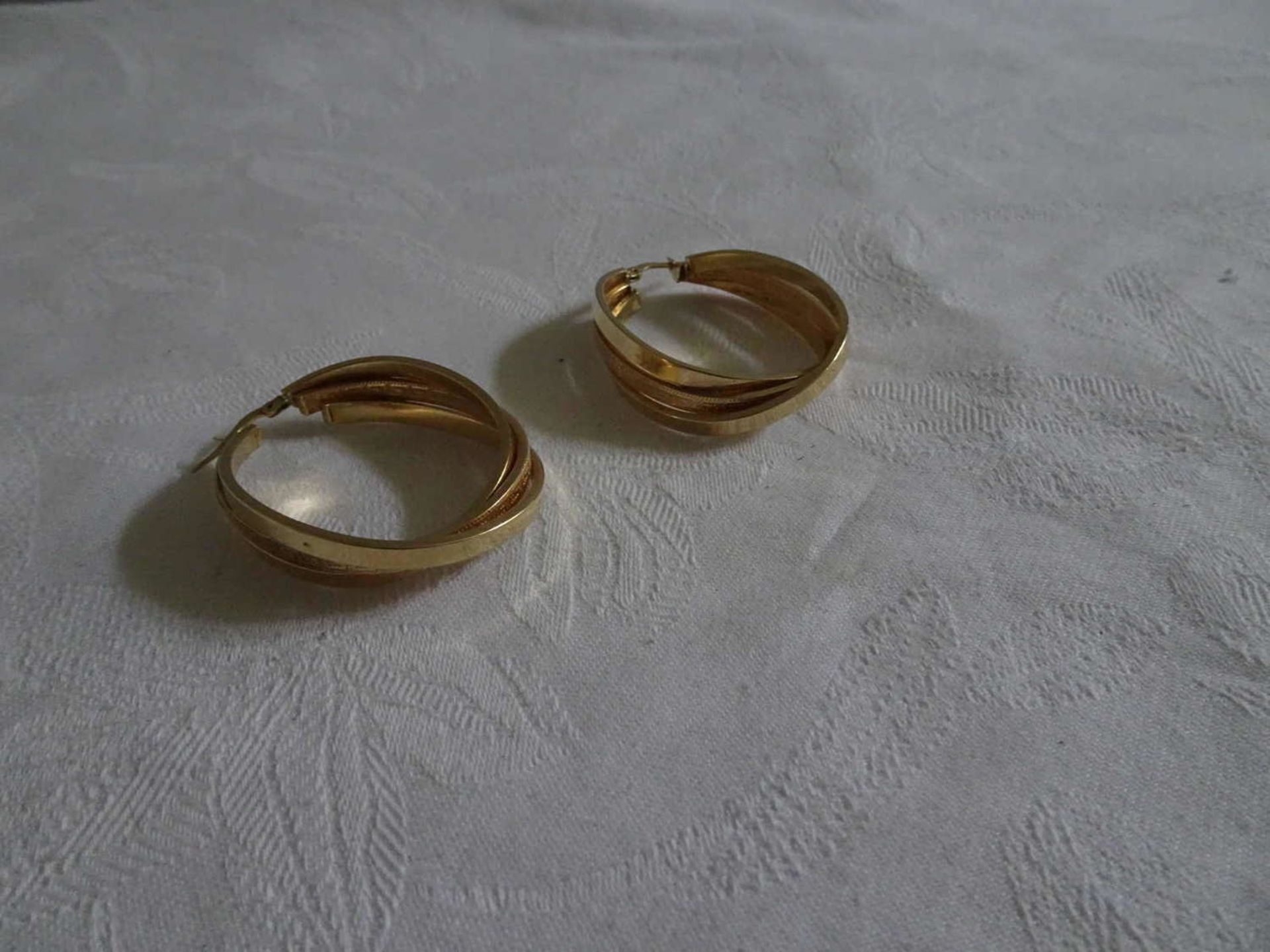 1 pair of hoop earrings, 585er yellow gold, weight about 6.4 gr.