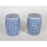 A pair of modern Chinese porcelain blue and white barrel shaped stools, 20th century, decorated with