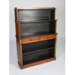 A 19th century mahogany and parcel gilt open bookcase, the upper section with pierced brass