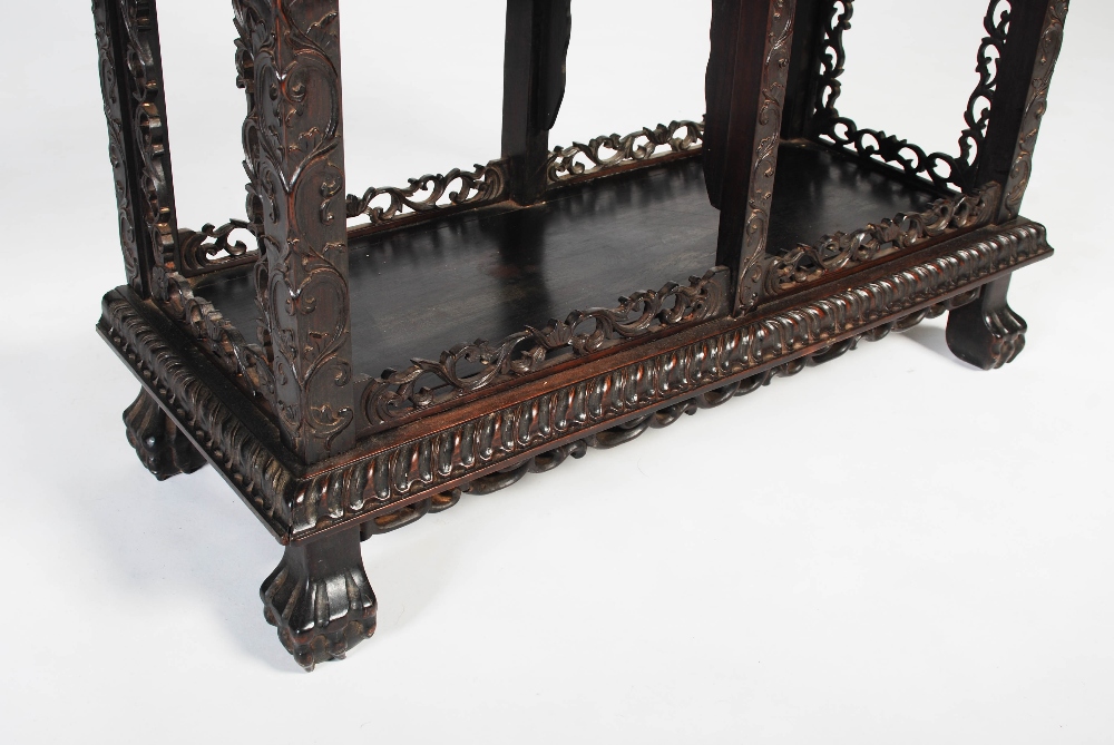 A Chinese dark wood display cabinet, Qing Dynasty, the pierced and scroll carved foliate frieze - Image 5 of 8