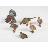 A collection of six miniature cold painted bronze birds, comprising; two Woodcock, 4cm high, a