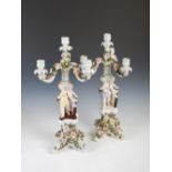 A pair of Sitzendorf porcelain four light flower encrusted candelabra, the scrolling arms