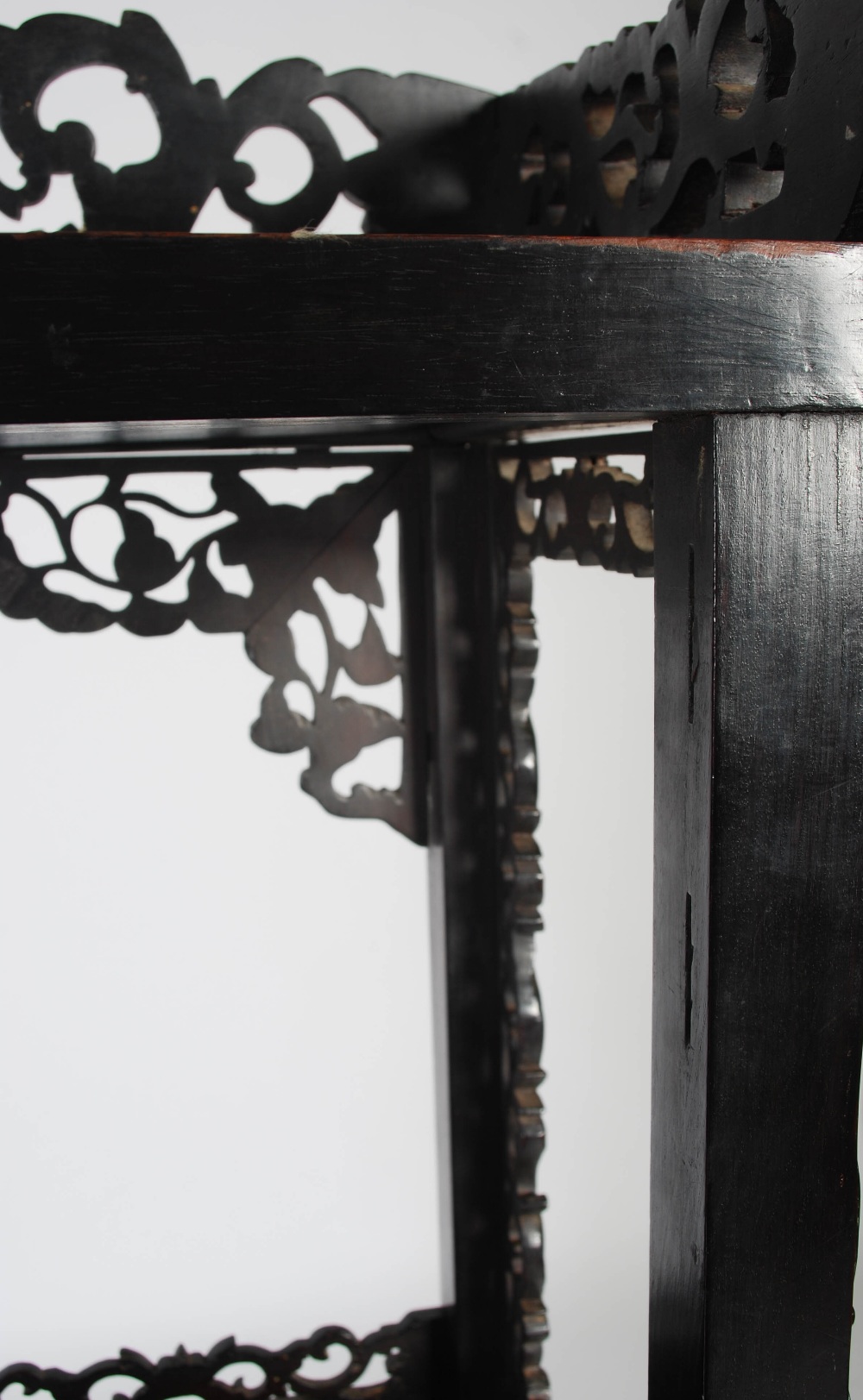 A Chinese dark wood display cabinet, Qing Dynasty, the pierced and scroll carved foliate frieze - Image 8 of 8