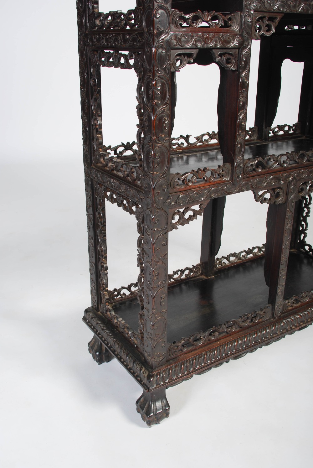 A Chinese dark wood display cabinet, Qing Dynasty, the pierced and scroll carved foliate frieze - Image 3 of 8