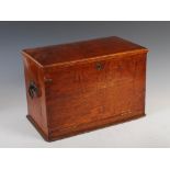 A late 19th century portable oak stationary cabinet/ writing slope, the hinged cover opening to a