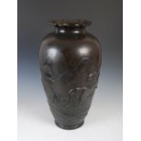 A large Japanese bronze vase, Meiji Period, decorated in relief with tigers, stag and other animals,