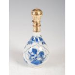 A Chinese porcelain blue and white yellow metal mounted snuff bottle, Qing Dynasty, decorated with